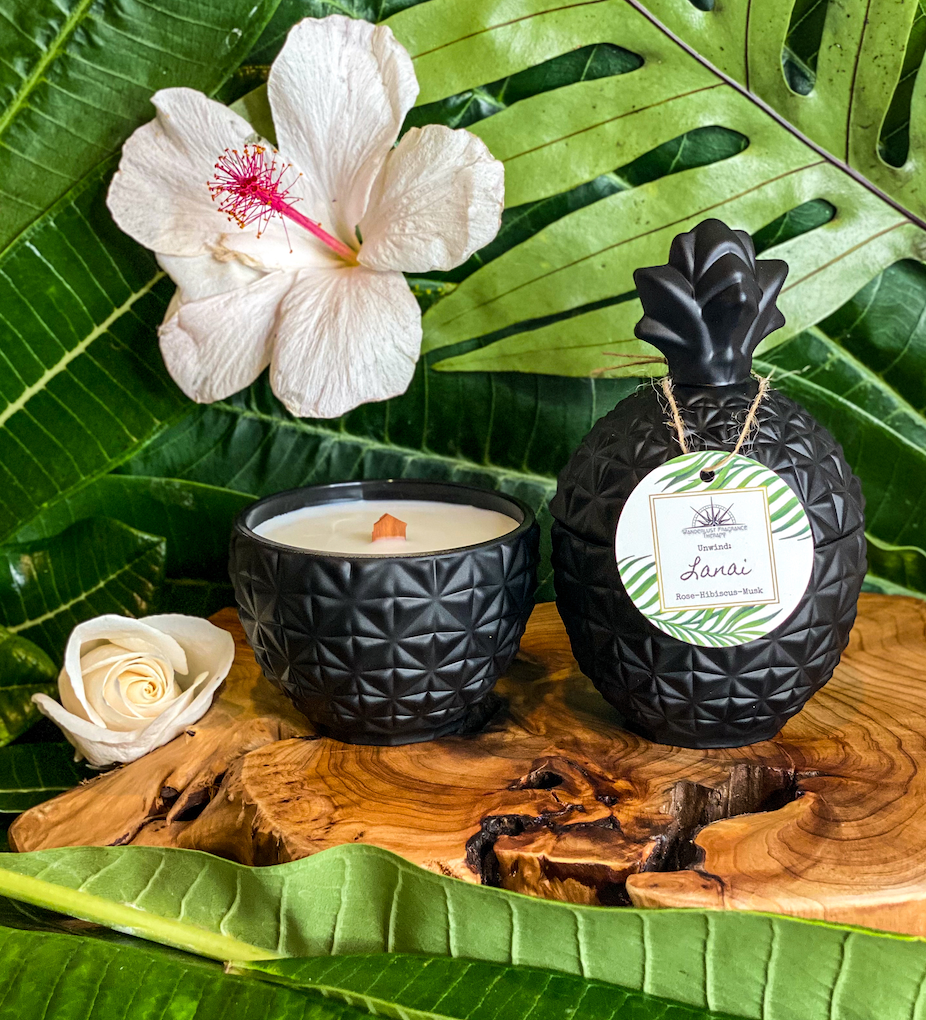 Candle in black pineapple jar scented with rose, hibiscus and musk.